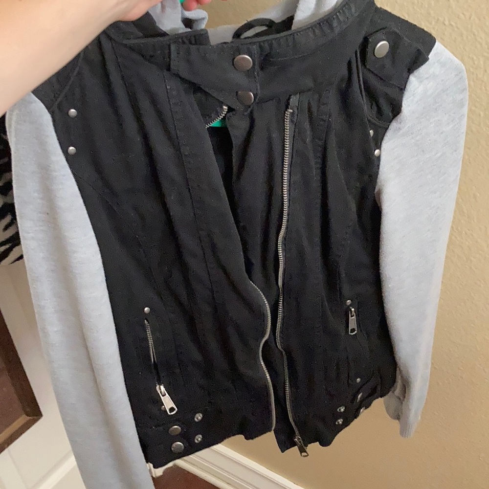 Black with gray sleeves and hood.